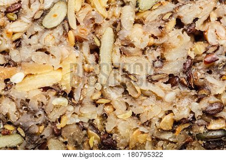 Food textures and patterns concept. Detailed closeup of whole grain bread with many big grains