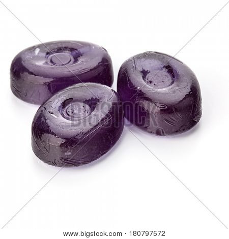 Three colorful fruit hard sugar candies,  boiled sweeties or sugar plums isolated on white background cutout