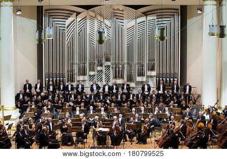 CRACOW POLAND - SEPTEMBER 25 2015: View of the stage of the concert hall at the Cracow Philharmonic with the new Orgelbau organ in the background. Cracow Poland