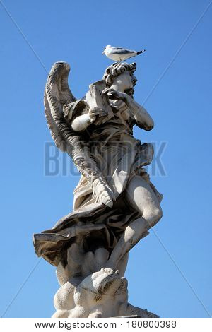 ROME, ITALY - SEPTEMBER 03: Statue of Angel with the Superscription by Gian Lorenzo Bernini, Ponte Sant Angelo in Rome, Italy  on September 03, 2016.
