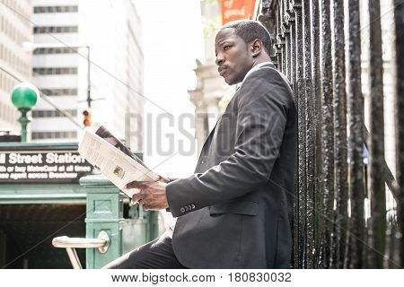 Businessman in full suit at Wall Street subway metro station
