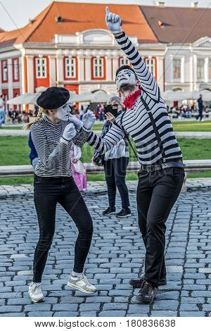 TIMISOARA ROMANIA - MARCH 31 2017: Pantomime couple with painted face present on the street inside the CheckART Carnival organized by the City Hall Timisoara. Union Square.