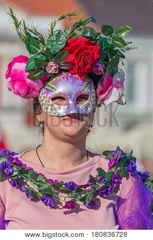 TIMISOARA ROMANIA - MARCH 31 2017: Woman dressed in period costumes and present on the street inside the CheckART Carnival organized by the City Hall Timisoara.