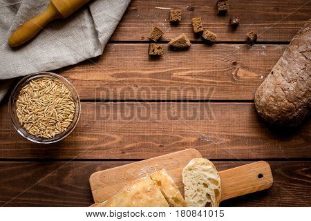 bakery concept with homemade fresh wheat bread on rustic kitchen table background top view moke-up