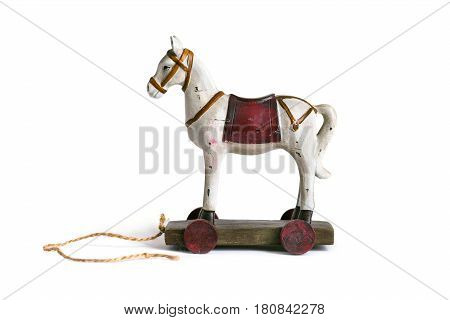 Vintage children's toy wooden horse on white background