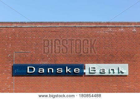 Odense, Denmark - April 9, 2017: Danske bank logo on a wall. Danske bank is the largest bank in Denmark and a major retail bank in the northern European region