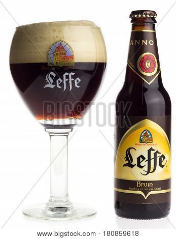 GRONINGEN, NETHERLANDS - APRIL 07, 2017: Bottle and glass of Belgian Leffe Bruin beer isolated on a white background