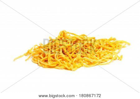 A lot of pasta. Dry pasta. Scattered pasta. Pasta background. Pasta in form of shells. Macaroni products. Macaroni background. Food background.
