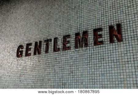 Vintage Gentlemen Sign Toilet Sign on tile