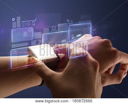 Female hand wearing smartwatch with statement labels around and dark background