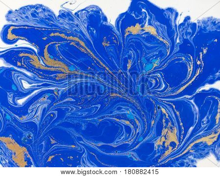 Blue and golden liquid texture. Watercolor hand drawn marbling illustration. Ink marble background