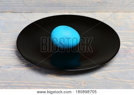 Traditional Easter Eggs Painted In Blue Color On Black Plate