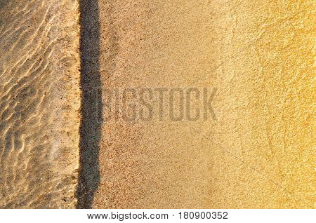 Soft wave of the sea on the sandy beach