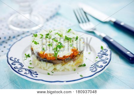 Layered salad with salted fish and boiled vegetables