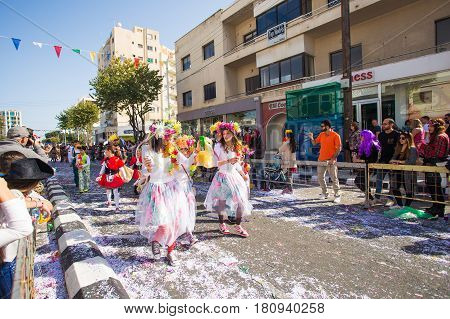 LIMASSOL, CYPRUS - FEBRUARY 26: Grand Carnival Parade - an unidentified people of all ages , gender and nationality in colorful costumes during the street carnival, February 26, 2017 in Limassol, Cyprus.