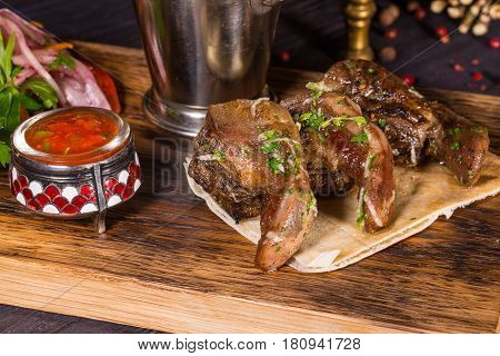 Mutton uvulas, are served with French fries and onions, red pepper, parsley and spices salad