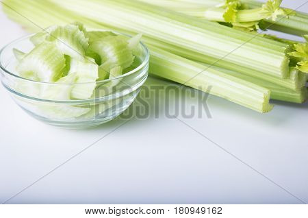 Celery in a  bowl on a white background