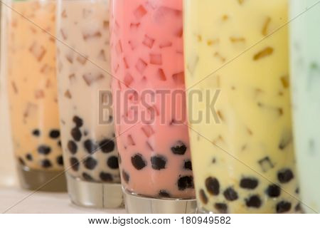 Boba / Bubble tea. Homemade Various Milk Tea with Pearls on wooden table.