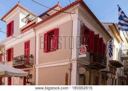 Traditional Rennovated Classical Building And Greek Flags In Nafplion.