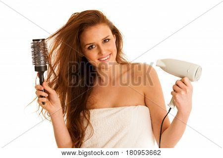 Beautiful Young Woman Holds Hair Brush And Blow Dryer Isolated Over White Bavkground
