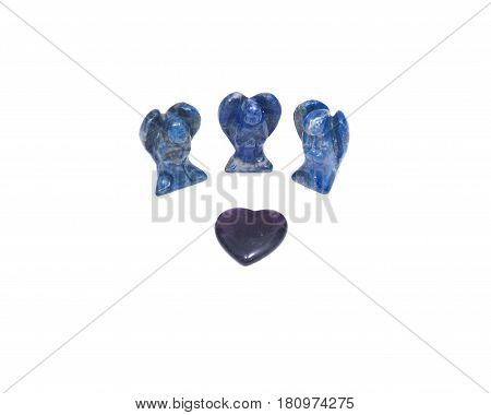Amethyst heart and three lapis lazuli angels isolated on white background