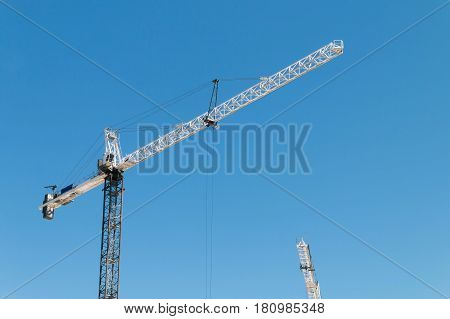 Building crane lifting material at a construction site