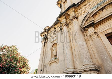 Ancient statue on the territory of the Church of the Nativity of Our Lady in Prcanj, Montenegro