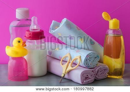 accessories for baby diapers on white background, banny, a bottle of water, cream