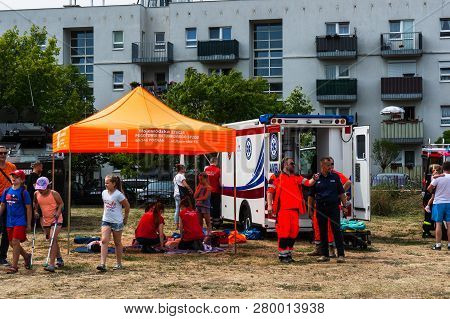 Poznan, Poland - June 9, 2018: Ambulance Workers Giving First Aid Instructions During The Bezpieczne