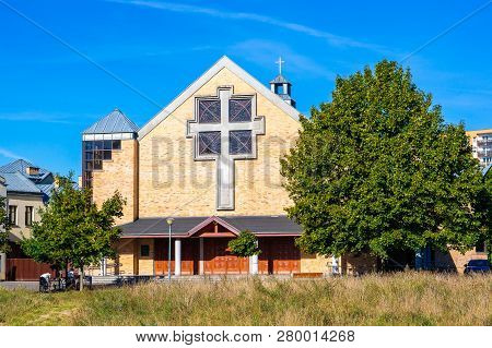 Poznan, Poland - September 16, 2018: Church With Cross Symbol By Trees And Grass At The Orla Bialego