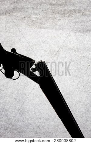 Classic Double-barrell Smooth-bore Hunting Rifle On Man Hand Isolated On Light Stone Background