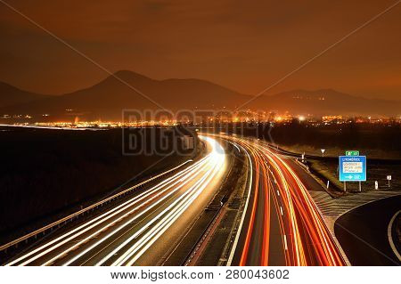 Highway D8 And Lovos Hill On Horizont In Night On 16th January In Czech Republic