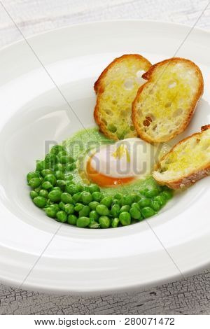 tear peas with poached egg, spanish basque cuisine