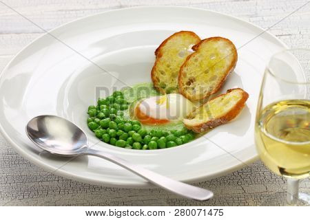 tear peas with poached egg, spanish basque cuisine