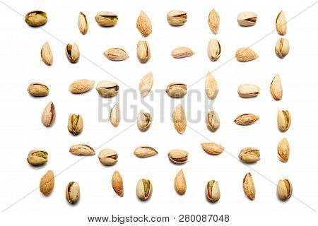 Inshell Pistachios, Cracked Pistachios  And Almond Badam On White Background, Top View. Pistachio An
