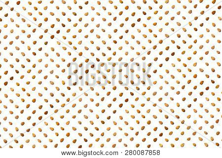 A Collection Of   Apricot Stone   Lie In Straight Rows Along Dioganals On An Isolated White Backgrou