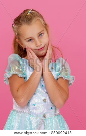 Beautiful Little Girl On A Pink Background. Concepts Style And Fashion, Happy Childhood.