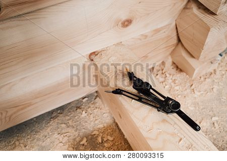 Compasses Lies On A Wooden Beam In Production