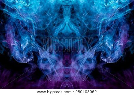 Thick Colorful Smoke Of Blue, Pink And Red  In The Form Of A Skull, Monster, Dragon On A Black Isola