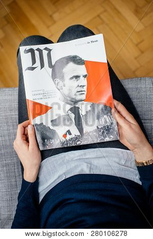 Paris, France - Jan 2, 2019: View From Above Of French Woman Reading M Le Magazine Du Monde With Con