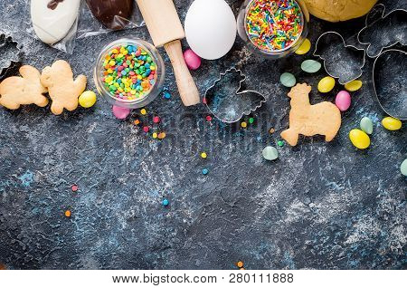 Easter Cooking Background, Dough And Indredients, Cuts For Cookies And Colored Sugar Décor For Bakin