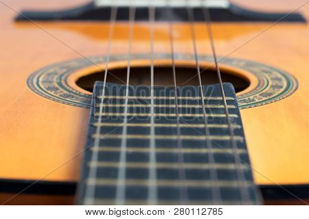 Closeup Wooden Classical Guitar. Old Classical Guitar With Nylon Strings. Old Acoustic Guitar