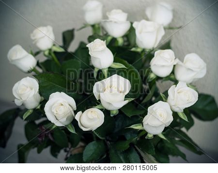 Bouquet Of White Roses On The Table In A Vase