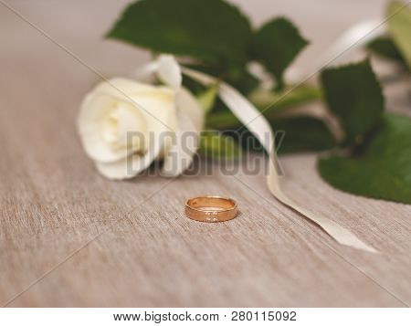 Wedding Ring And Cream Rose. Wedding Symbols, Attributes. Holiday, Celebration. Macro. Blur.