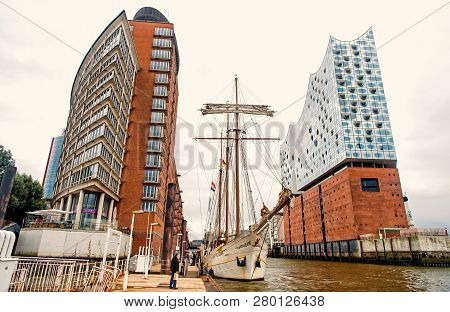 Hamburg, Germany - September 07, 2017: Yacht And Philharmonic Concert Hall On Elbe River On Urban Ba