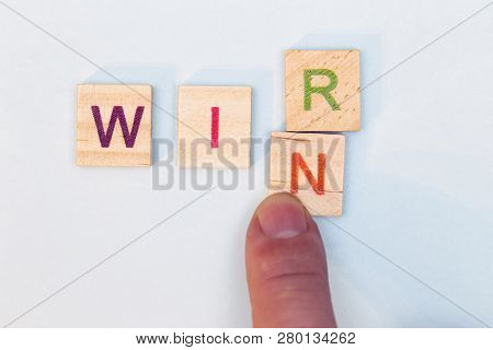 The R In The Word We Is Erased By An N, This Results In The Word Win, Wir Means In German We