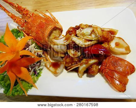 Stir Fried Mini Lobster With Tamarind Xo Sauce Served On Ceramic Dish In Local Restaurant