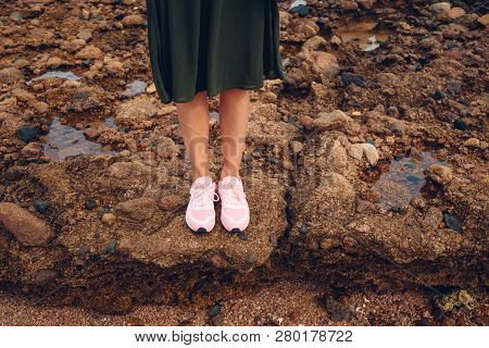 A Girl Standing On The Coral Shore. Exotic Travel Concept. Uncharted Land