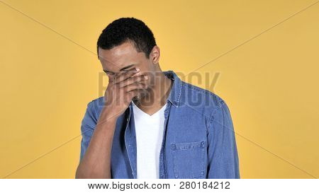 Sad Upset Young African Man Isolated On Yellow Background