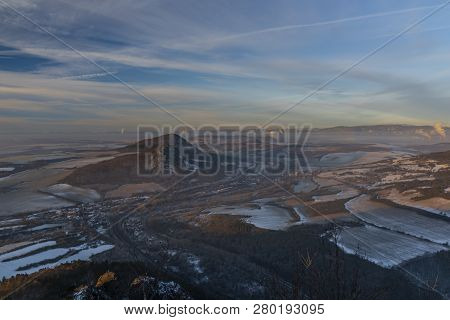 Sunrise On Boren Hill Near Bilina Town In Winter Frosty Color Morning